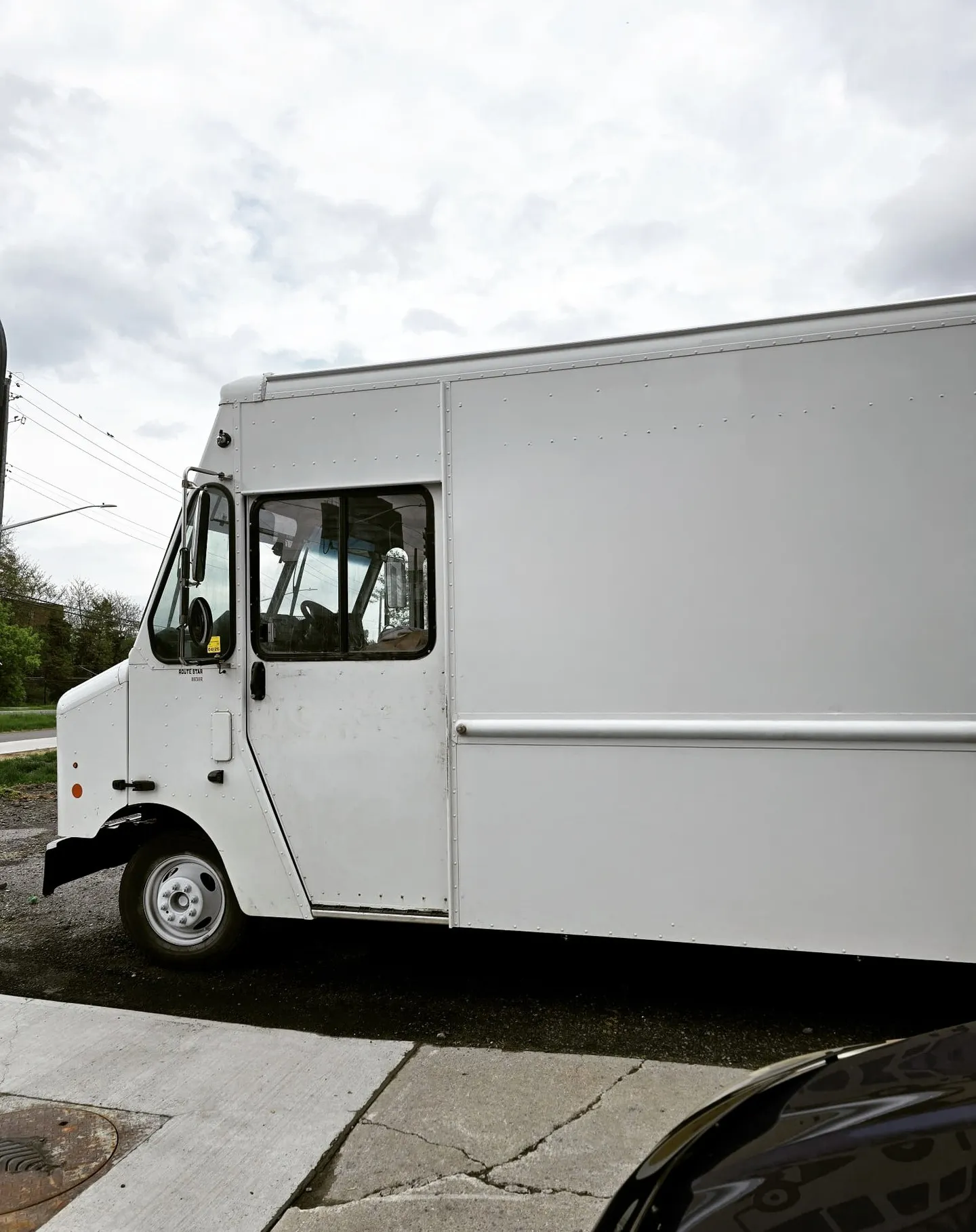 Bare white step van side panel before the printed graphic was applied