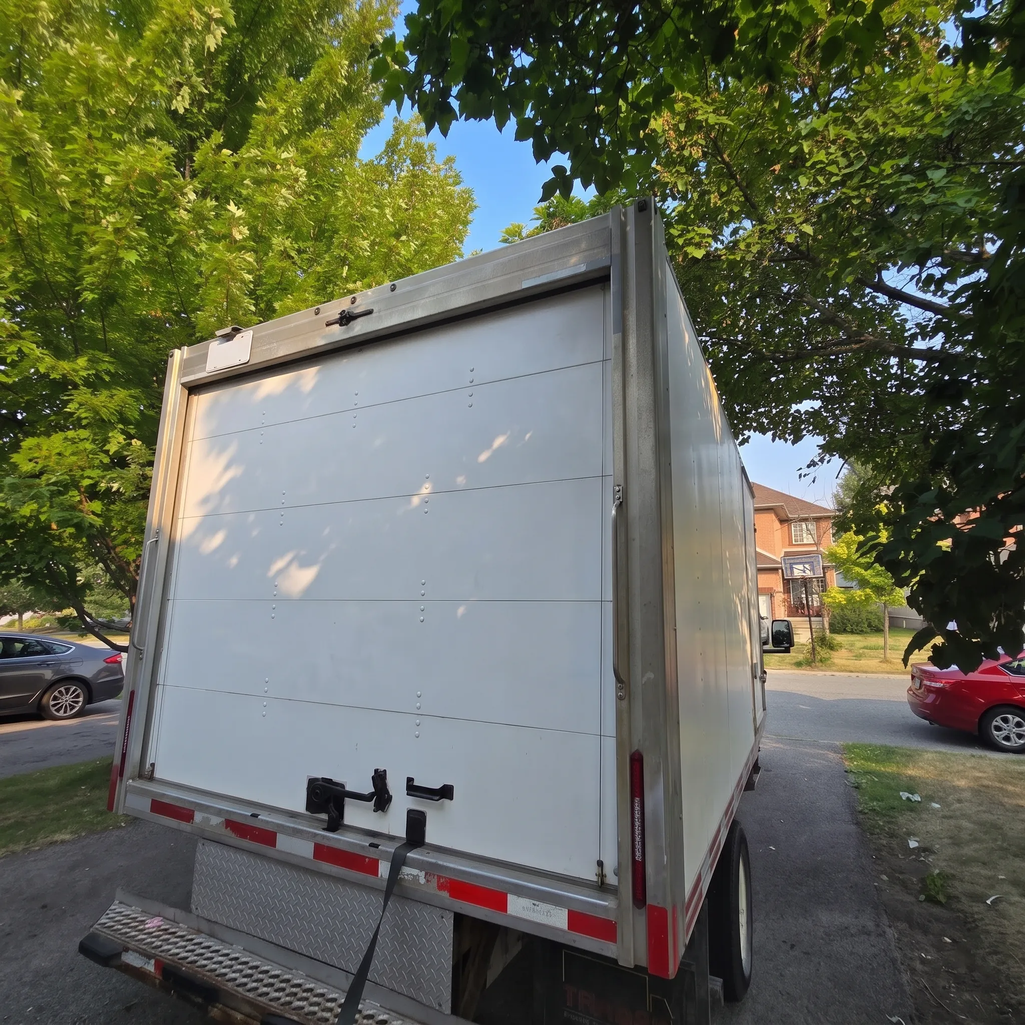 Bare white cube van box before the printed wrap was applied