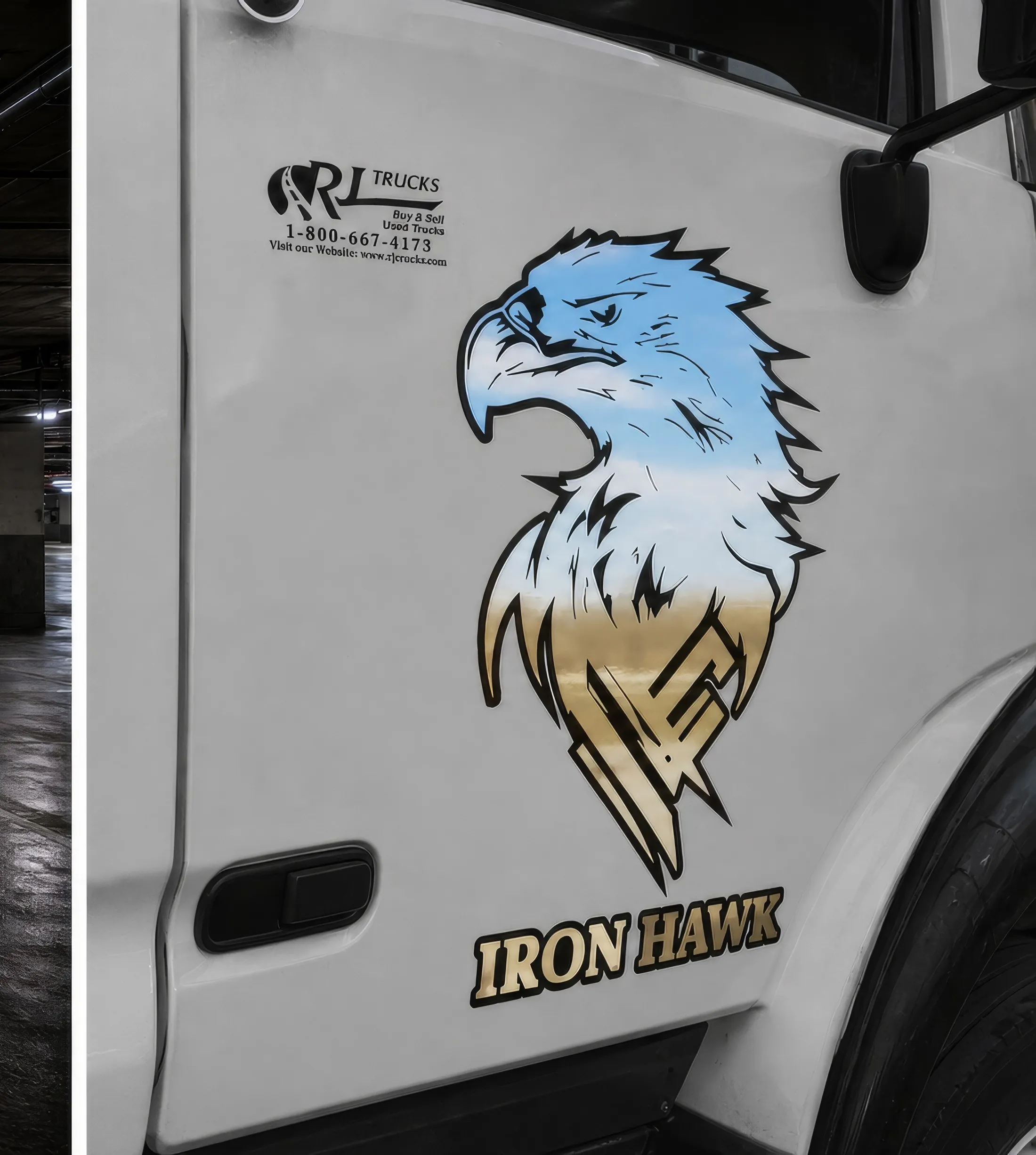 Printed eagle graphic and Iron Hawk lettering applied to the cab door of a white truck